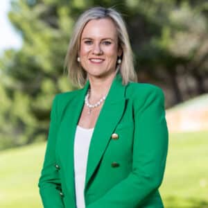 New CEO Rebecca Girdwood in a green blazer with a white shirt and shoulder length blonde hair
